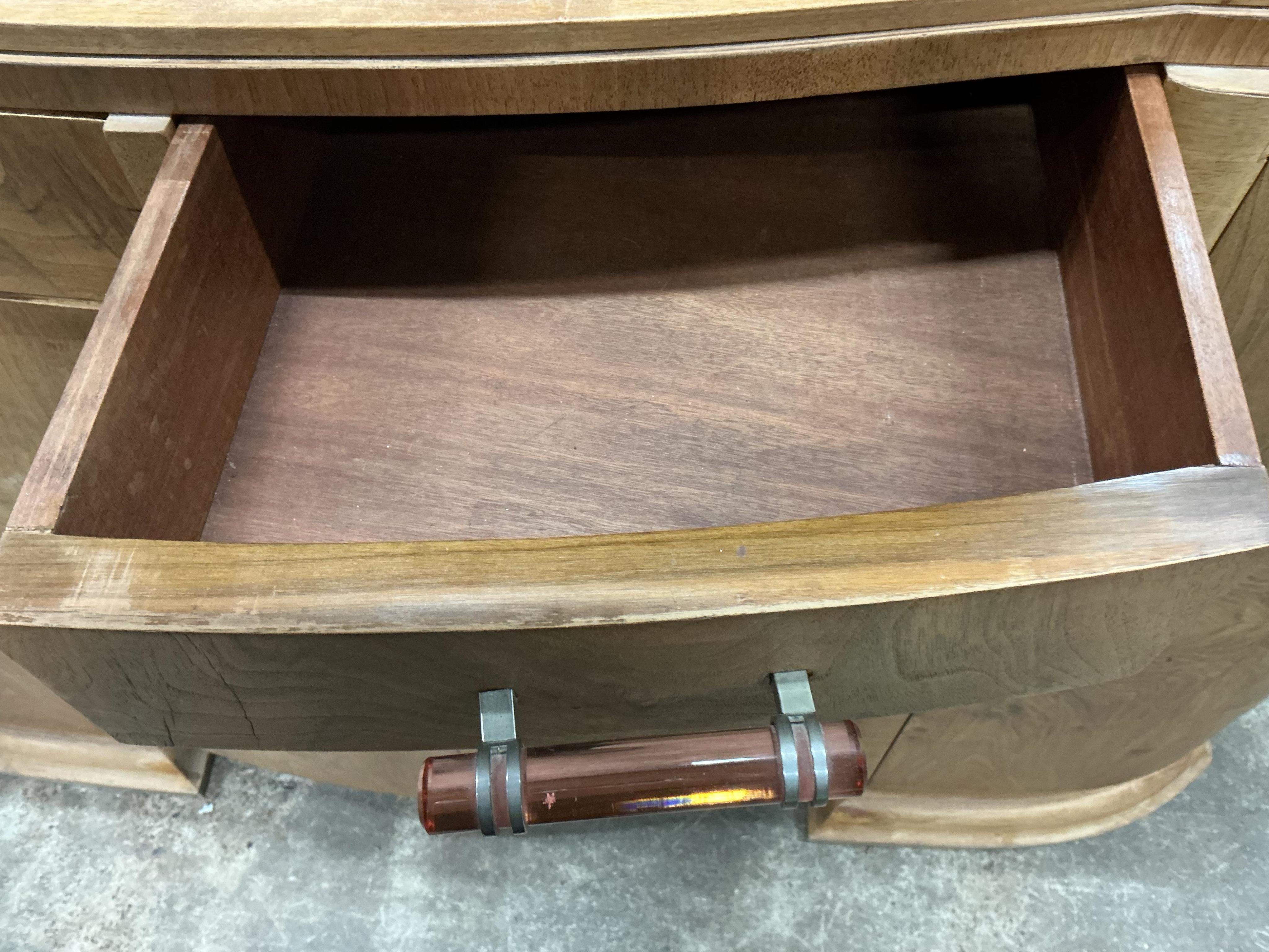An Art Deco walnut marble topped bow front sideboard, width 158cm, depth 50cm, height 110cm